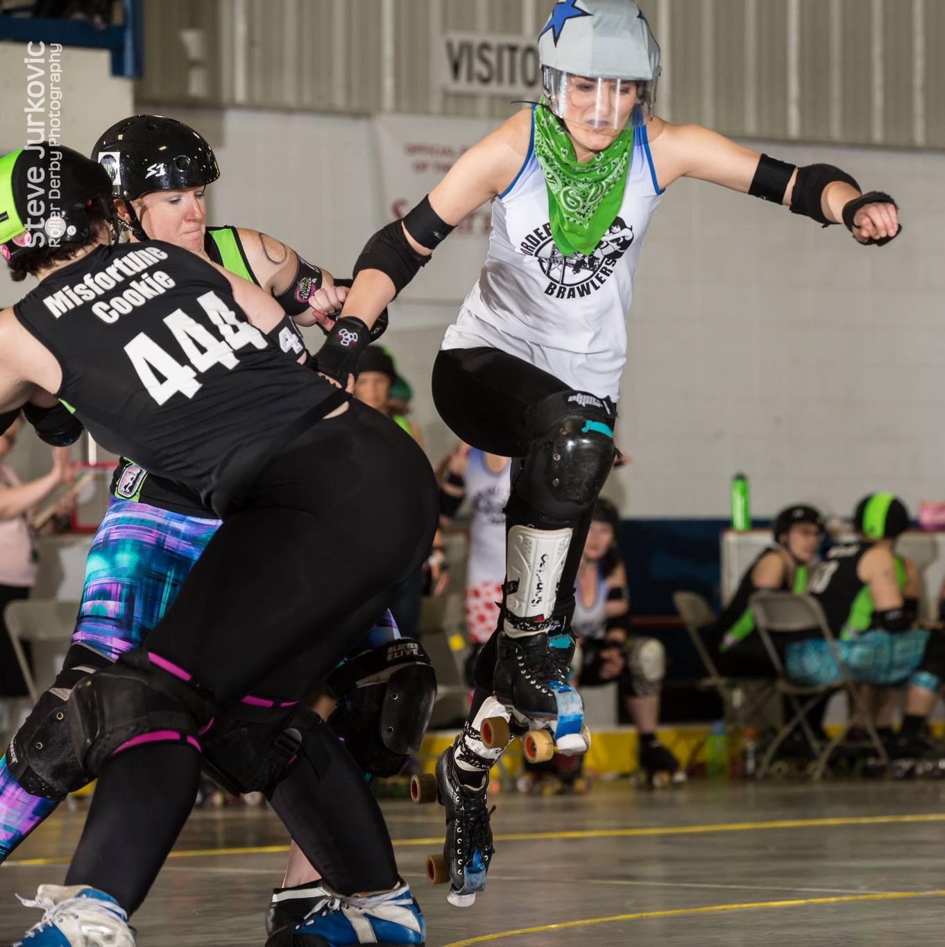 Kate playing roller derby, jumping the apex as a jammer